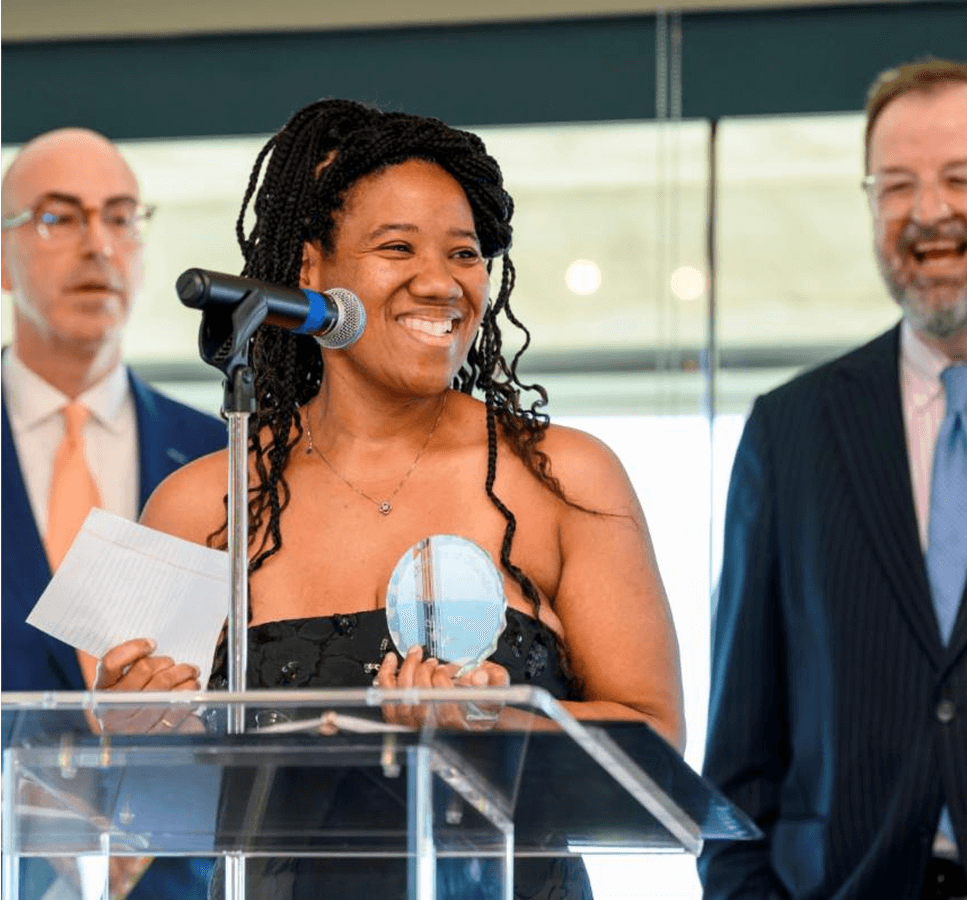 img-4 Image of Tonya accepting an award