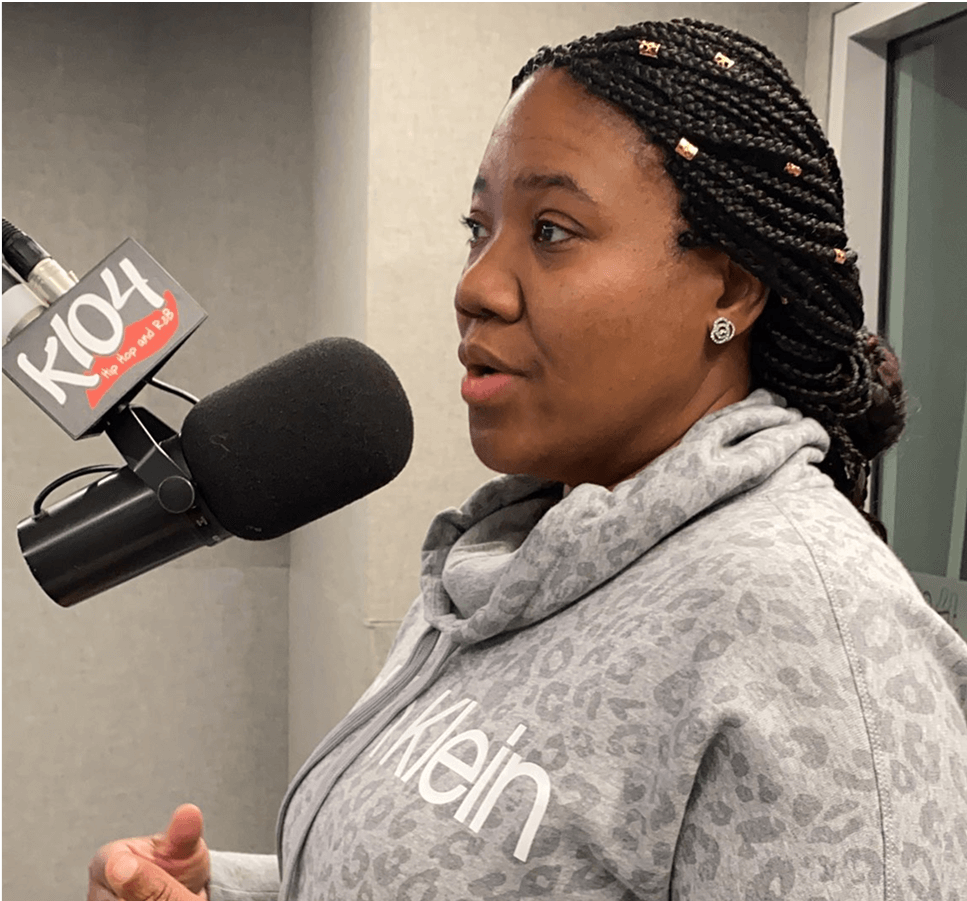 img5 Image of Tonya at a k104 radio station talking into a mic